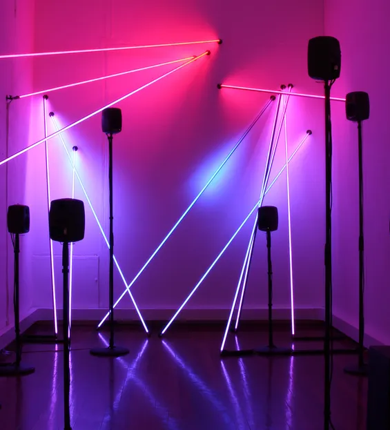 Photo of a light and sound sculpture installed in a gallery. Post Truth and Beauty by Tim Murray-Browne and Aphra Shemza.