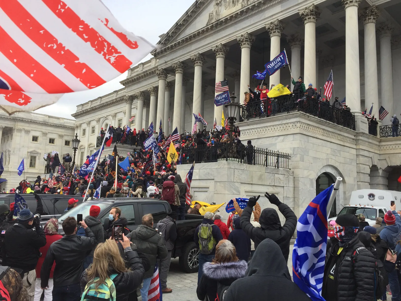 A photo of protesters storming the capitol building. Photo (CC-BY-SA) by TapTheForwardAssist.