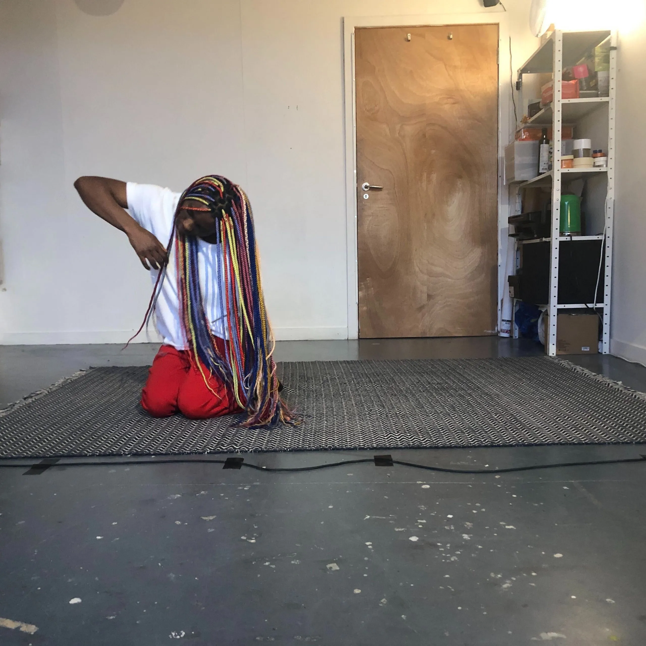 Dancer Divine Tasinda improvising with the Sonified Body system during an exploratory lab at the studio in Glasgow.