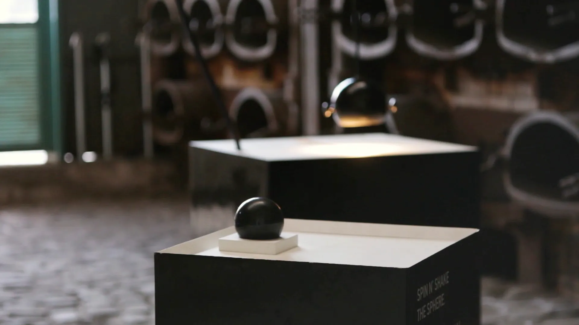 A video still by Anastasia Alekseeva showing the sonicsphere instrument at rest on a plinth at Athens Science Festival 2018.