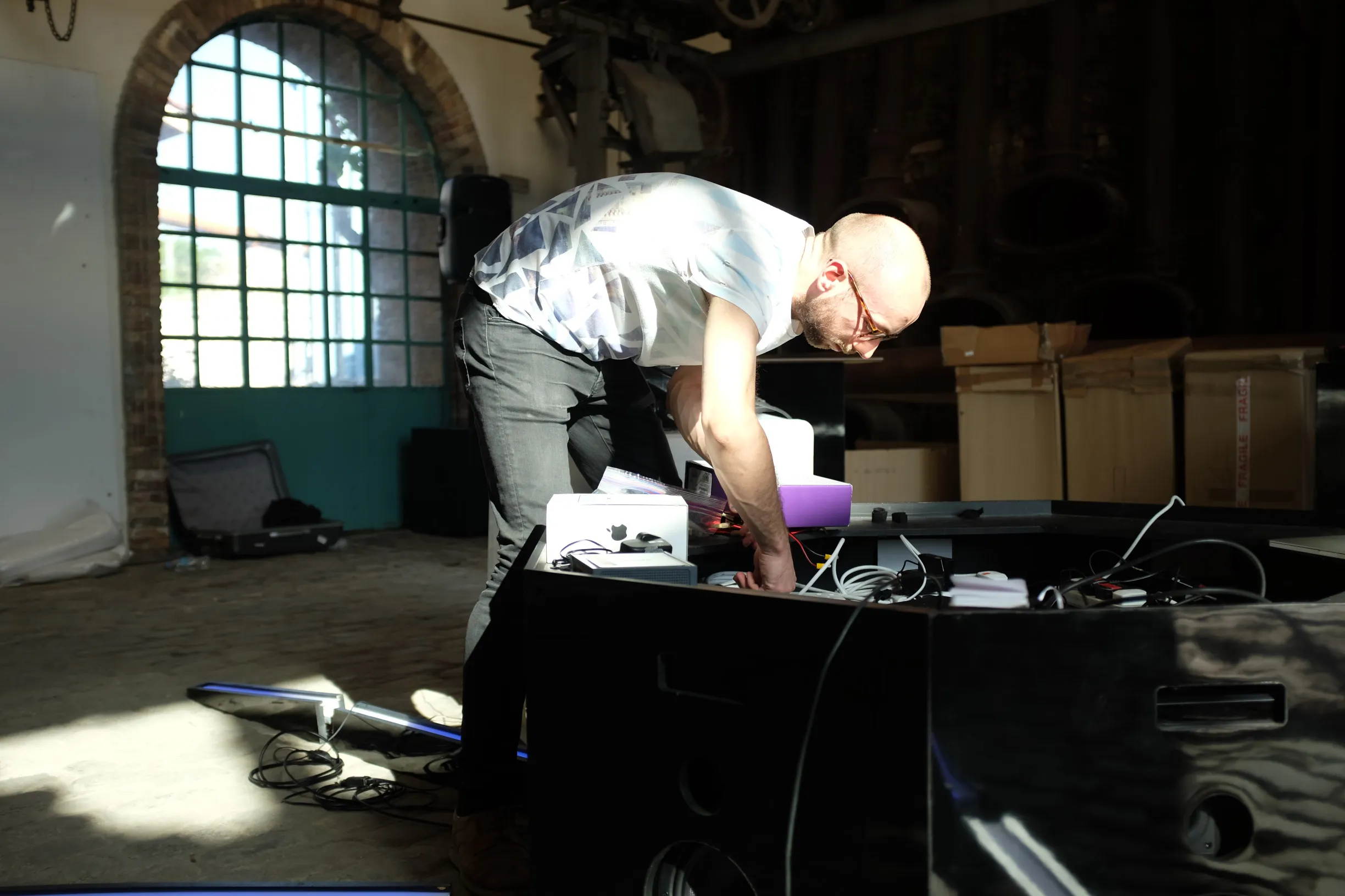 Photo showing Tim Murray-Browne building Cave of Sounds at Athens Science Festival. Photo by Anastasia Alekseeva.