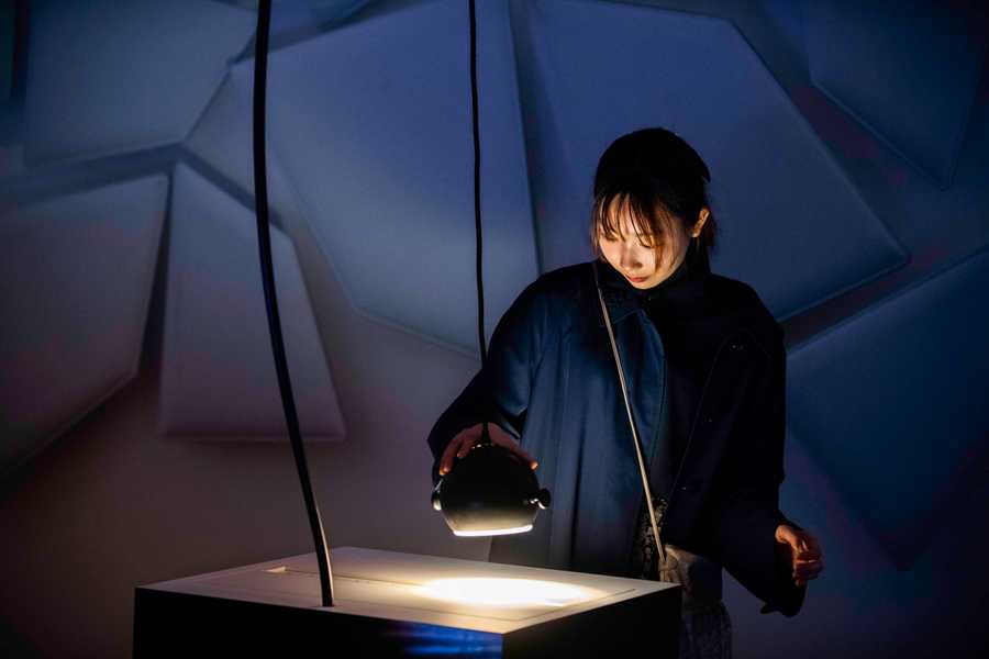 Participants playing with the Cave of Sounds interactive sound installation at Milan's Museum of Science and Technology. Photographer: Andrea Fasani