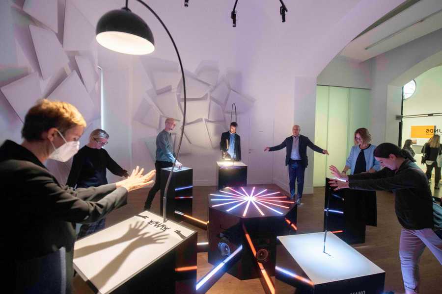 Participants playing with the Cave of Sounds interactive sound installation at Milan's Museum of Science and Technology. Photographer: Andrea Fasani