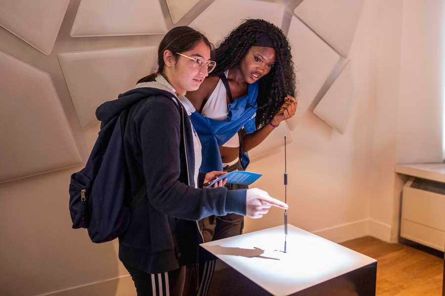 Participants playing with the Cave of Sounds interactive sound installation at Milan's Museum of Science and Technology. Photographer: Andrea Fasani
