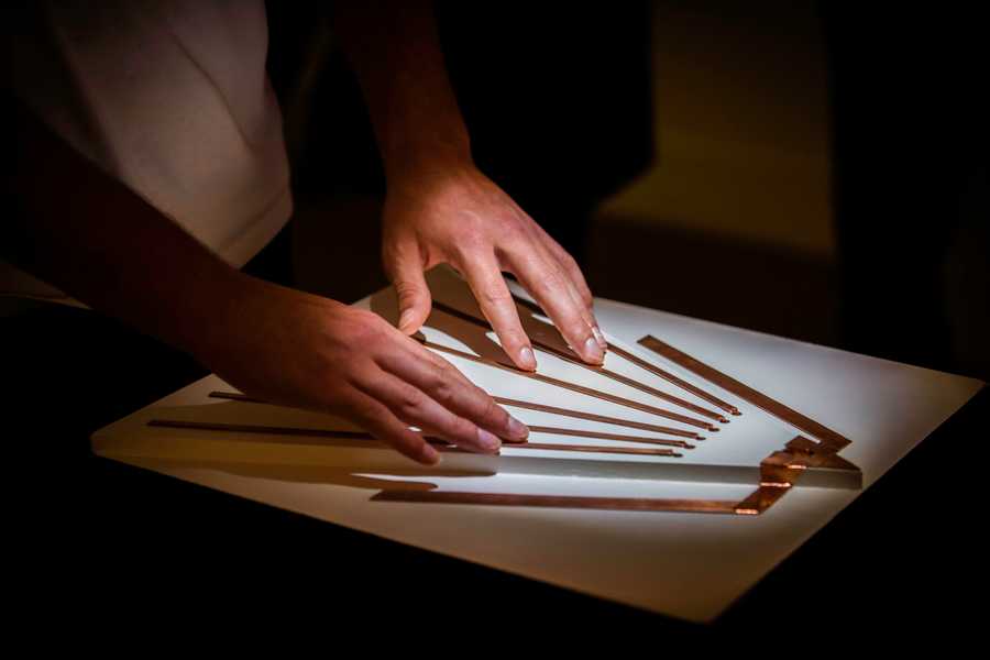 Participants playing with the Cave of Sounds interactive sound installation at Milan's Museum of Science and Technology. Photographer: Andrea Fasani
